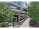 Exterior view of a restaurant with patio seating and modern architectural design, surrounded by lush greenery at 1590 Sunnybrook Farm Rd, Atlanta, GA 30350