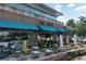 Upscale restaurant featuring an outdoor patio with ample seating and stylish decor in a lively urban setting at 1590 Sunnybrook Farm Rd, Atlanta, GA 30350