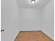 Clean, minimal room with laminate wood flooring, white walls and baseboards at 1590 Sunnybrook Farm Rd, Atlanta, GA 30350