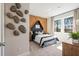 Unique bedroom design with a decorative rock wall, designer headboard and well-lit interior at 3268 Shirecrest Ln, Dacula, GA 30019