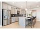 Spacious kitchen featuring stainless steel appliances, a large island, and sleek gray cabinetry at 3268 Shirecrest Ln, Dacula, GA 30019