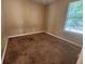 Bedroom with a window featuring natural light and carpeted floor at 535 Village Cir, Stockbridge, GA 30281