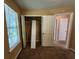 Bedroom with natural light, open closet, and entry to other rooms at 535 Village Cir, Stockbridge, GA 30281