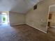 Living room showcasing high ceilings and an open layout, leading to the entryway and kitchen at 535 Village Cir, Stockbridge, GA 30281