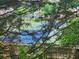 Community tennis courts seen through trees at 535 Village Cir, Stockbridge, GA 30281