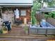 Outdoor deck features ample seating, a grill, and privacy fencing at 770 Barnett Street Ne, Atlanta, GA 30306