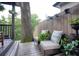 Outdoor deck area featuring comfortable seating, decorative planters, and a charming view of a mature tree at 770 Barnett Street Ne, Atlanta, GA 30306