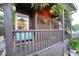 Inviting front porch with wood railings, hanging plants, and comfortable bench seating at 770 Barnett Street Ne, Atlanta, GA 30306