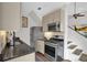 Modern kitchen featuring stainless steel appliances and subway tile backsplash at 770 Barnett Street Ne, Atlanta, GA 30306