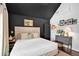 Main bedroom with dark vaulted ceiling, light walls and sophisticated decor at 770 Barnett Street Ne, Atlanta, GA 30306