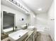 Bathroom featuring double sinks, granite counters, and a jacuzzi tub at 7972 Woodlake Dr, Riverdale, GA 30274