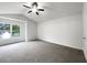 Bright bedroom featuring vaulted ceilings, a ceiling fan, and ample natural light at 7972 Woodlake Dr, Riverdale, GA 30274