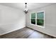 Bedroom with a light fixture and a window with outdoor views at 7972 Woodlake Dr, Riverdale, GA 30274