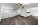 Spacious living room with vaulted ceilings, a ceiling fan, and modern flooring at 7972 Woodlake Dr, Riverdale, GA 30274
