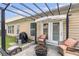 Cozy backyard patio area is equipped with outdoor seating, a fire pit, and sun shade at 918 Harvest Brook Dr, Lawrenceville, GA 30043