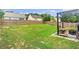 Fenced in backyard features a well-maintained lawn with a patio, a fire pit, and outdoor seating at 918 Harvest Brook Dr, Lawrenceville, GA 30043