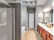 Well-lit bathroom featuring double vanity sinks, a shower, a bathtub, and ample storage at 918 Harvest Brook Dr, Lawrenceville, GA 30043