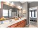 Bathroom with double vanity sinks and a view into the main bedroom at 918 Harvest Brook Dr, Lawrenceville, GA 30043