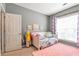 Bedroom featuring neutral colors, large windows and cute animal artwork at 918 Harvest Brook Dr, Lawrenceville, GA 30043