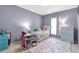 Cozy bedroom with a desk and colorful décor at 918 Harvest Brook Dr, Lawrenceville, GA 30043