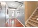 Welcoming foyer featuring hardwood floors, neutral walls, and staircase access to the upper level at 918 Harvest Brook Dr, Lawrenceville, GA 30043