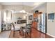 Bright kitchen with stainless steel refrigerator, hardwood floors, and an open view to the living room at 918 Harvest Brook Dr, Lawrenceville, GA 30043
