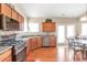The kitchen features stainless steel appliances and access to the dining area at 918 Harvest Brook Dr, Lawrenceville, GA 30043
