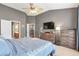 Large main bedroom featuring neutral tones, vaulted ceilings, and a ceiling fan at 918 Harvest Brook Dr, Lawrenceville, GA 30043