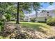 Expansive backyard surrounded by mature trees and lush green foliage at 1875 Conners Ct, Lawrenceville, GA 30044