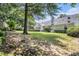 Large backyard with healthy green grass, and mature trees. Perfect for enjoying the outdoors at 1875 Conners Ct, Lawrenceville, GA 30044