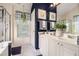 Stylish bathroom with double sinks, vanity, plenty of natural light, and modern fixtures at 1875 Conners Ct, Lawrenceville, GA 30044