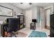 Cozy bedroom with gray walls, a map art piece, and a comfortable workspace for working from home at 1875 Conners Ct, Lawrenceville, GA 30044