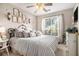 Cozy bedroom featuring neutral tones, comfortable bedding, and lots of natural light at 1875 Conners Ct, Lawrenceville, GA 30044