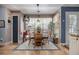 Charming dining area with a decorative rug and sunlit window at 1875 Conners Ct, Lawrenceville, GA 30044