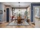 Charming dining area with a sunny window, decorative rug, and traditional-style furniture at 1875 Conners Ct, Lawrenceville, GA 30044