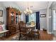 Formal dining room showcasing hardwood floors, chandelier, and stylish decor at 1875 Conners Ct, Lawrenceville, GA 30044
