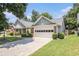 Charming one story home with brick and siding, a two car garage and manicured landscaping at 1875 Conners Ct, Lawrenceville, GA 30044