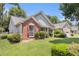 Charming one story home with brick and siding and well-manicured landscaping at 1875 Conners Ct, Lawrenceville, GA 30044
