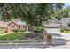 Charming single-story home with brick and siding, featuring a well-manicured front yard and a two-car garage at 1875 Conners Ct, Lawrenceville, GA 30044