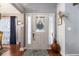 Inviting front door with sidelights and a decorative wreath on wood floors at 1875 Conners Ct, Lawrenceville, GA 30044