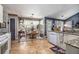 Bright eat-in kitchen featuring tile floors, matching appliances, and a bright sunny window at 1875 Conners Ct, Lawrenceville, GA 30044