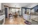 Eat-in kitchen area filled with natural light, granite countertops, and modern appliances at 1875 Conners Ct, Lawrenceville, GA 30044