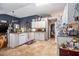 Open kitchen with granite countertops, tile flooring, and a ceiling fan at 1875 Conners Ct, Lawrenceville, GA 30044
