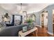 Comfortable living room with hardwood floors, gray walls, fireplace, and ample seating at 1875 Conners Ct, Lawrenceville, GA 30044