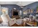 Cozy living room with vaulted ceilings, TV, hardwood floors, a ceiling fan and comfortable seating at 1875 Conners Ct, Lawrenceville, GA 30044
