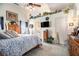 Bright bedroom with ceiling fan and decor, featuring a neutral color palette at 1875 Conners Ct, Lawrenceville, GA 30044