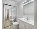 Well-lit bathroom featuring a double vanity and a mirrored closet at 5021 Rodrick Trce, Marietta, GA 30066