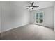 Bright bedroom with a ceiling fan and large window offering natural light at 5021 Rodrick Trce, Marietta, GA 30066
