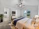 Bright bedroom featuring carpet, large windows, vaulted ceiling, and an ensuite bathroom at 5021 Rodrick Trce, Marietta, GA 30066