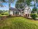 Well-maintained two-story home with a landscaped front yard and two-car garage at 5021 Rodrick Trce, Marietta, GA 30066